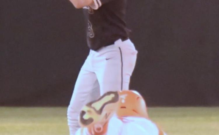 Pirate second baseman Diagan Venable signals to hold the ball as an Orangefield Bobcat runner steals second. Photo by Randall Luker