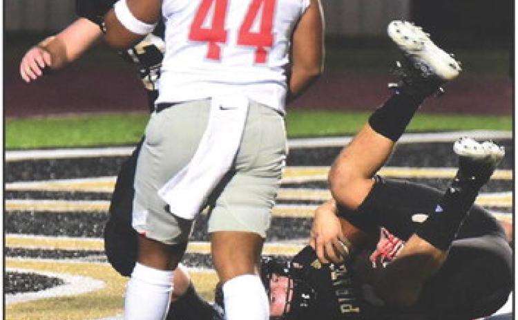 Jarrett Odom is upended as he scores a touchdown. Also pictured is blocking back Caleb Dean. Photos by Randall Luker
