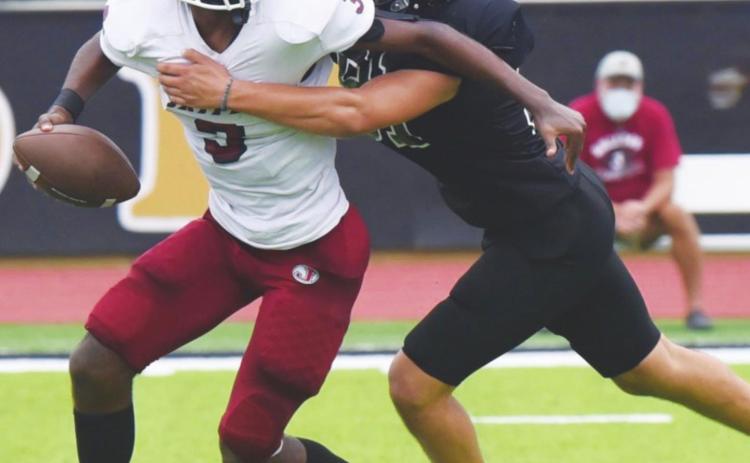 Jarrett Odom breaks through the defense to sack the Jasper QB.
