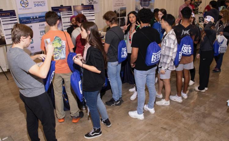 Students gather at the Port of Beaumont booth.